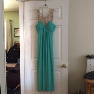 Beautiful teal dress with crystal accents.